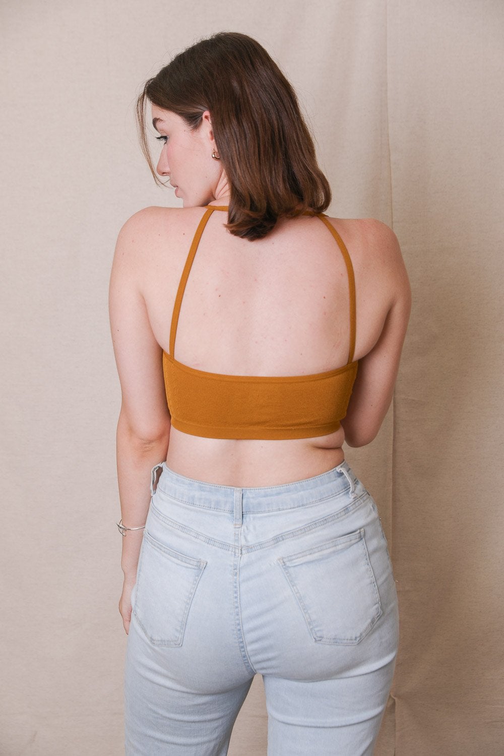 Seamless pullover bralette mustard back view.